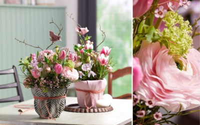 Österliche Frühlingsfloristik in ummantelten Töpfen mit rosa und pinkfarbenen Blumen
